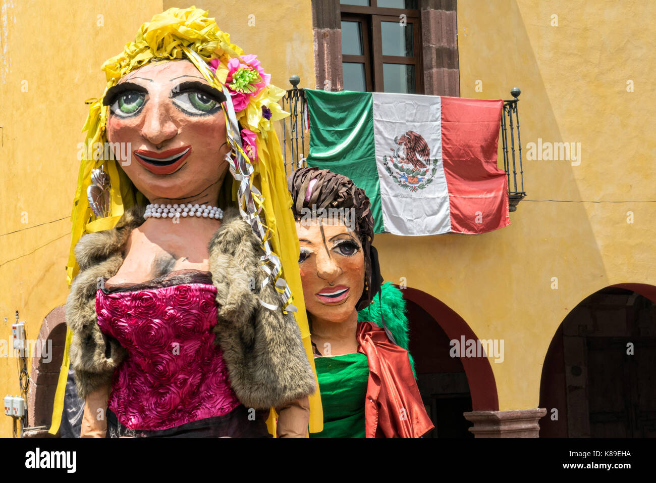 Giant papier mache puppets called mojigangas dance in the Jardin