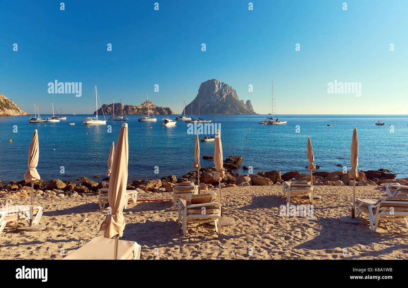 Cala d'Hort beach. Cala d'Hort in summer is extremely popular, beach have a fantastic view of the mysterious island of Es Vedra. Ibiza Island, Baleari Stock Photo