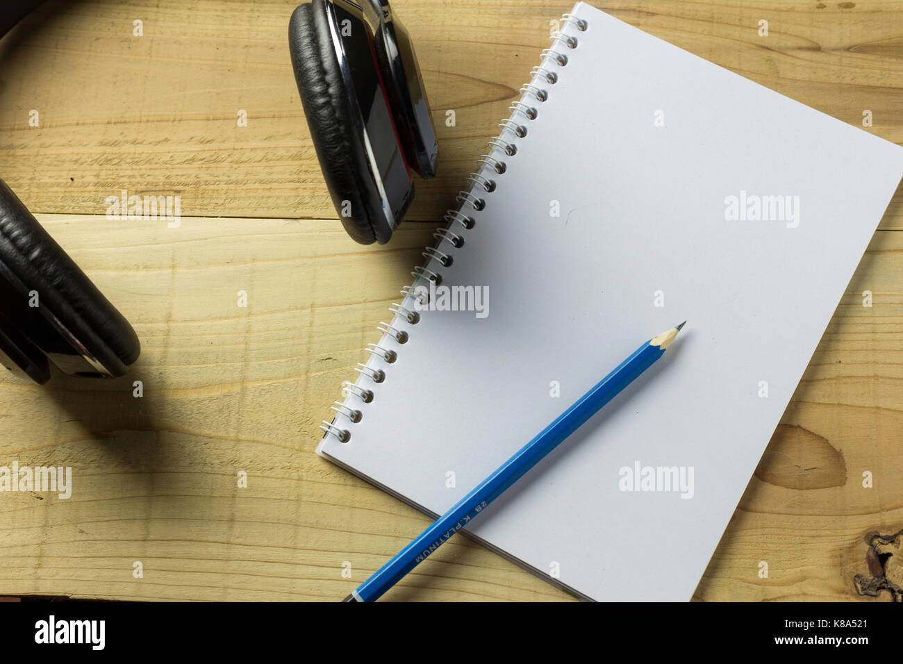 Premium Photo  Notebook with black sheets and white spiral binder and black  pen on a dark background, top view, copy space. business or education  minimal concept