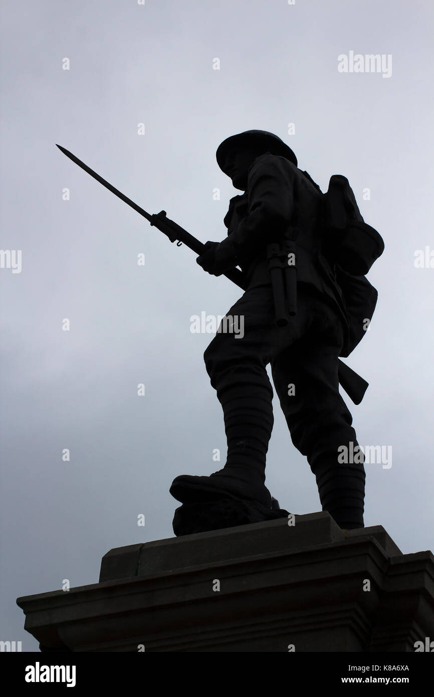 Silhouette of a British Tommy with drawn bayonet on a war memorial in Portstewart in Northern Ireland Stock Photo