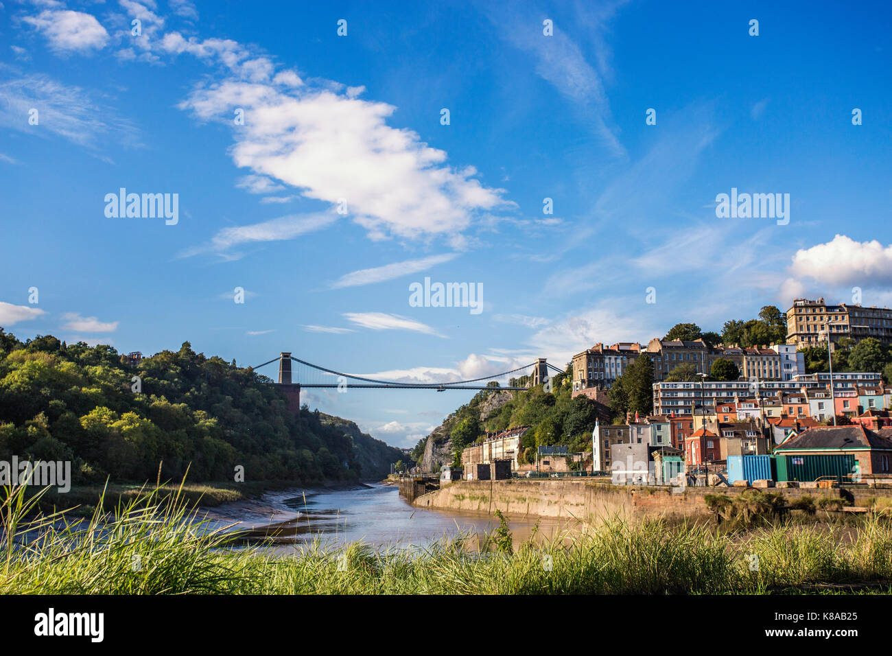 The Clifton suspension bridge straddles the Avon gorge with the river Avon below at a low tide Stock Photo