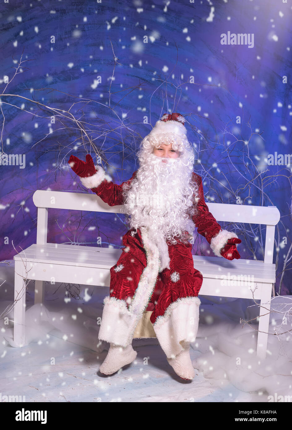 Kid in Santa Claus costume Stock Photo