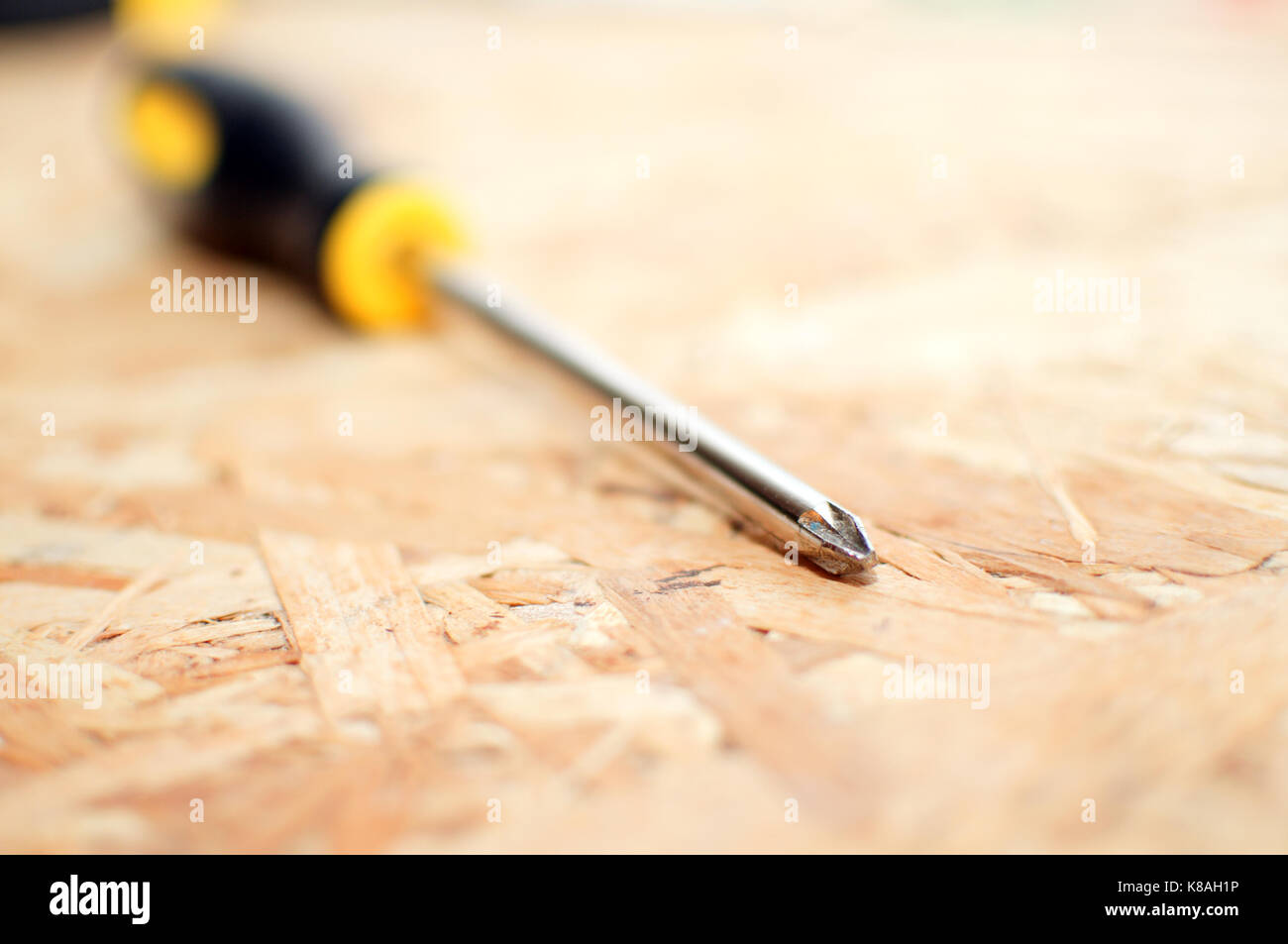 Philips screwdriver on a wooden shelf Stock Photo