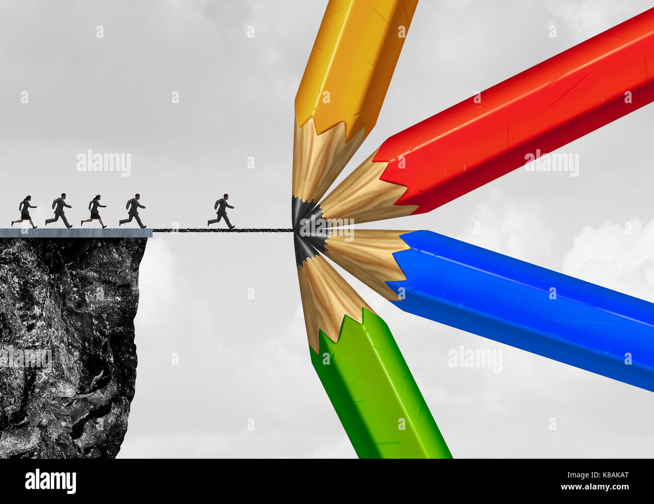 Group drawing a bridge and conquering adversity business concept as people running from a cliff with the help of a team of diverse pencils. Stock Photo