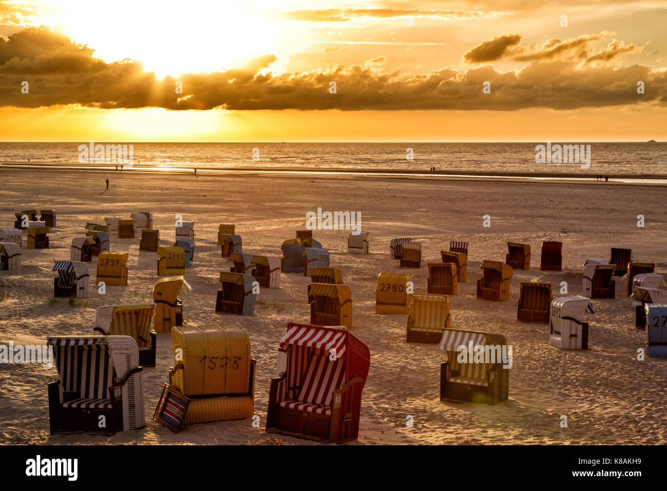 Sunset and dramatic sky over the beach on the north sea island Juist, East Frisia, Germany, Europe. Stock Photo
