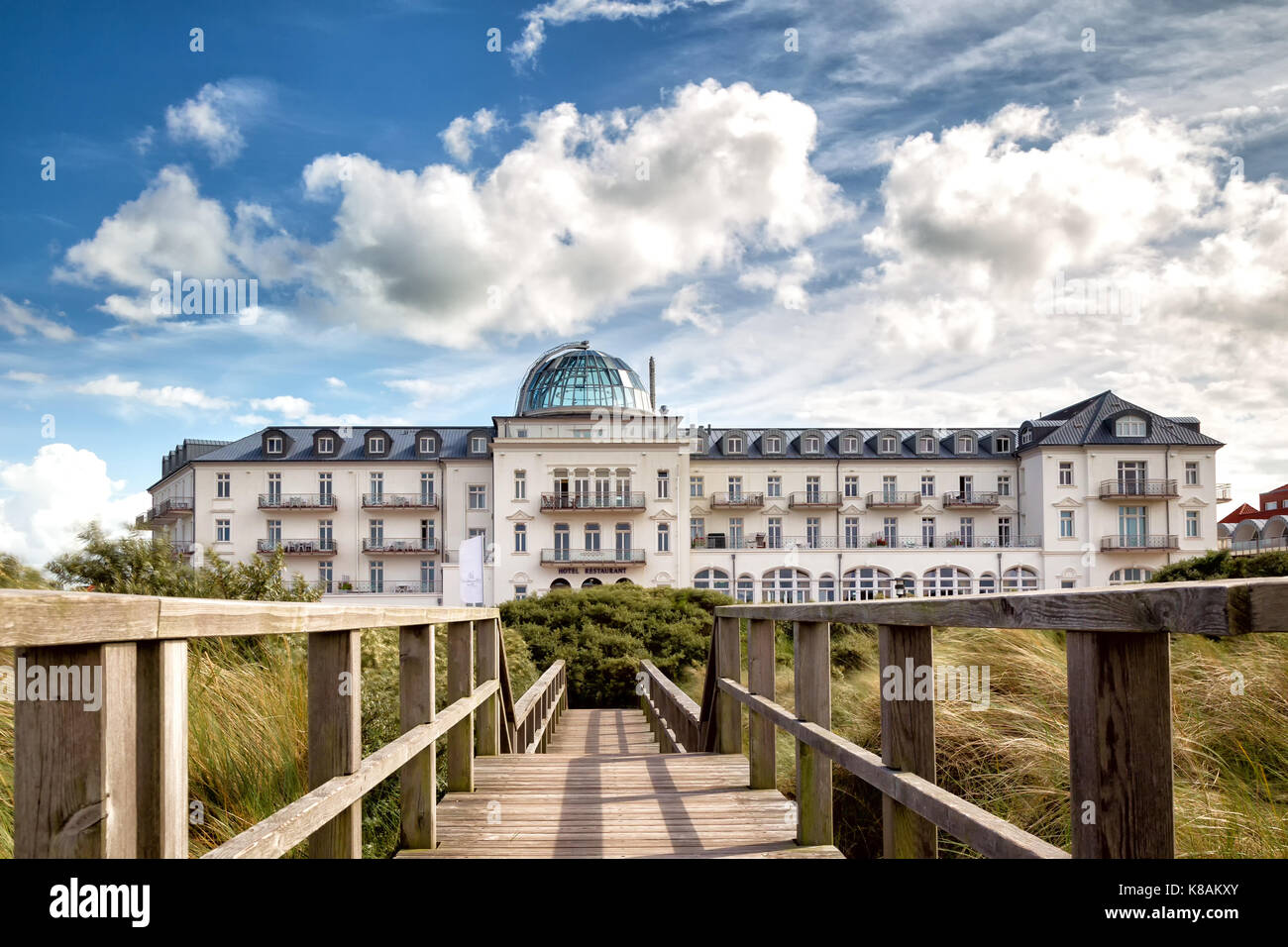 Clouds moving over the Kurhaus on the north sea island Juist in East Frisia, Germany, Europe. Stock Photo
