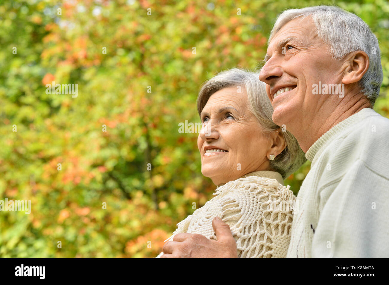 caucasian senior couple in the park Stock Photo - Alamy