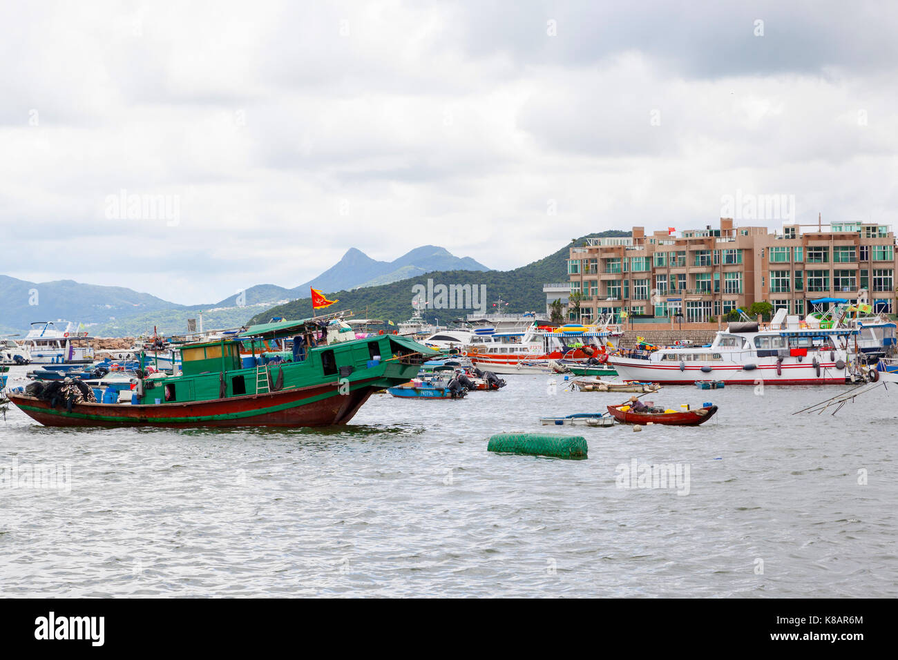 Hong Kong July 13 2017 Fishing And Tour Boats Dock At The Busy Harbor In Sai Kung Town Famous For Its Quaint Fishing Villages And The Floating Sea Hong Kong July 13 2017 Fishing And Tour Boats Dock At The Busy Harbor In Sai Kung Town Famous For Its Quaint Fishing Villages And The Floating Sea