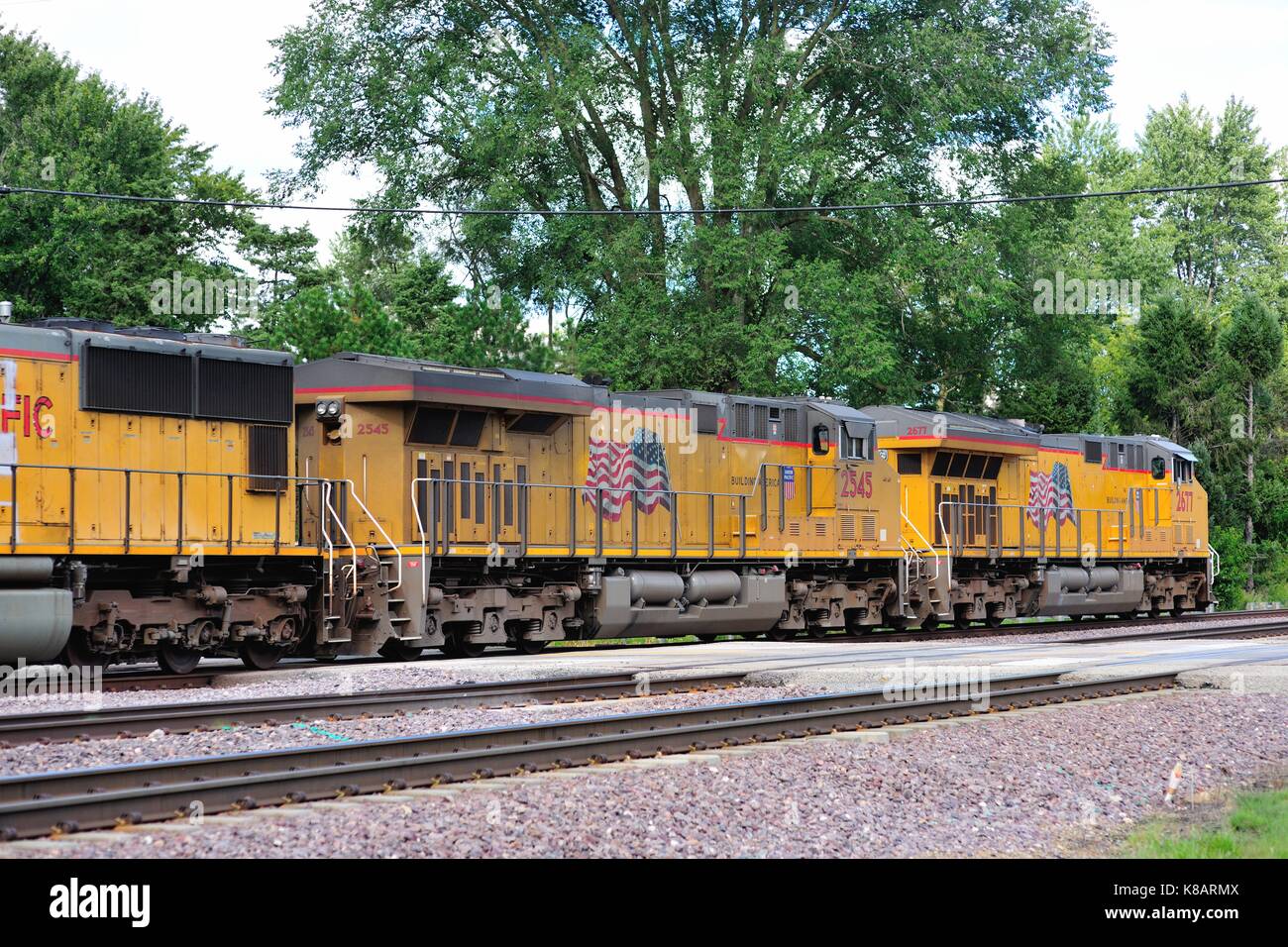 Multiple locomotive units head a Union Pacific freight train through Multiple locomotive units head a Union Pacific freight train through