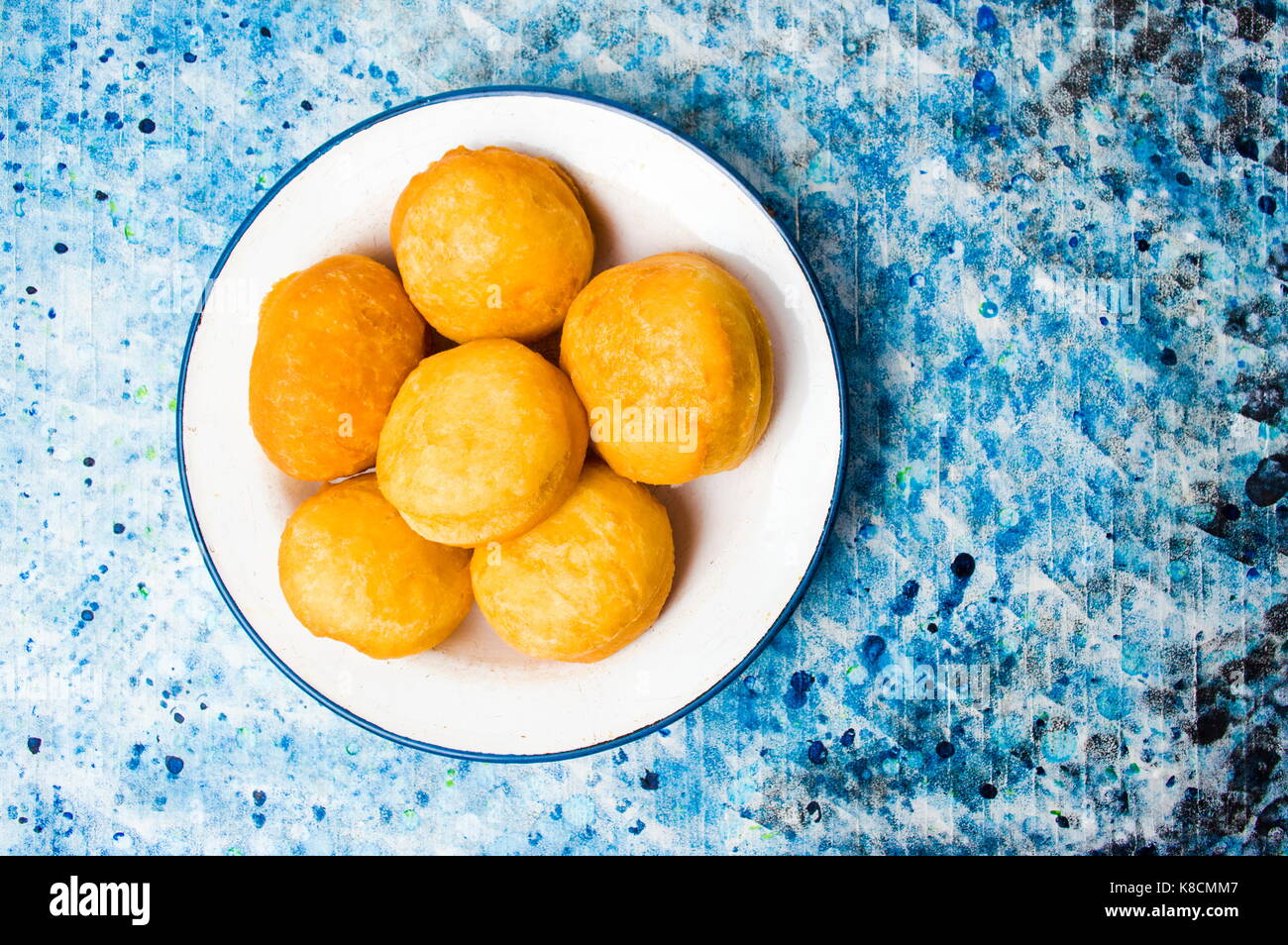 Homemade doughnuts covered with sugar powder on a plate Stock Photo
