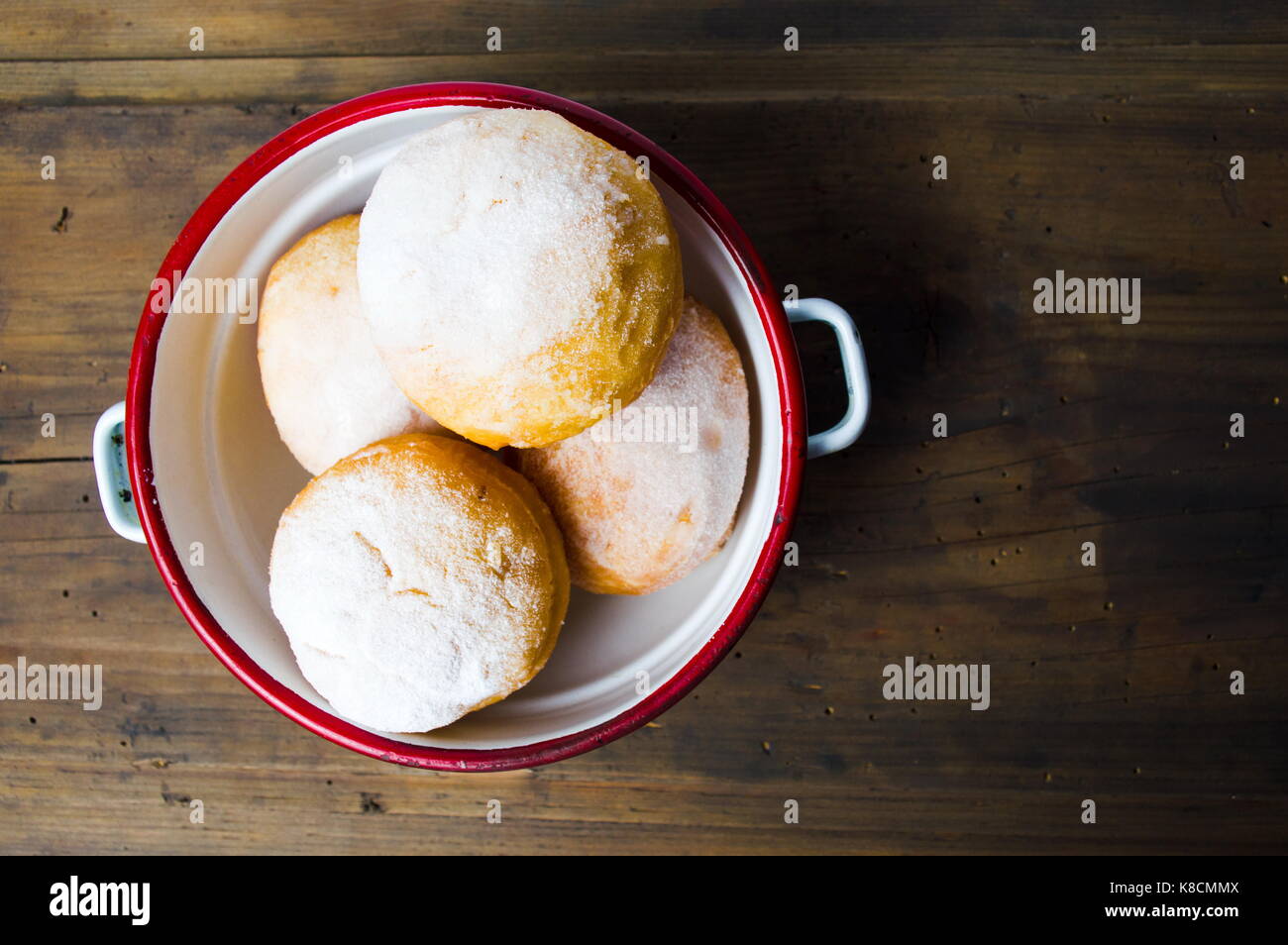 Homemade doughnuts covered with sugar powder on a plate Stock Photo