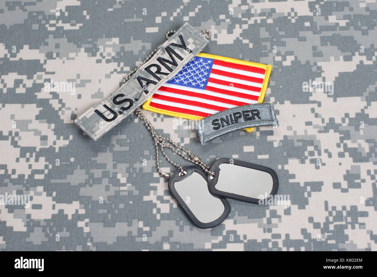 KIEV, UKRAINE - May. 02, US ARMY sniper tab with blank dog tags on camouflage uniform Stock Photo