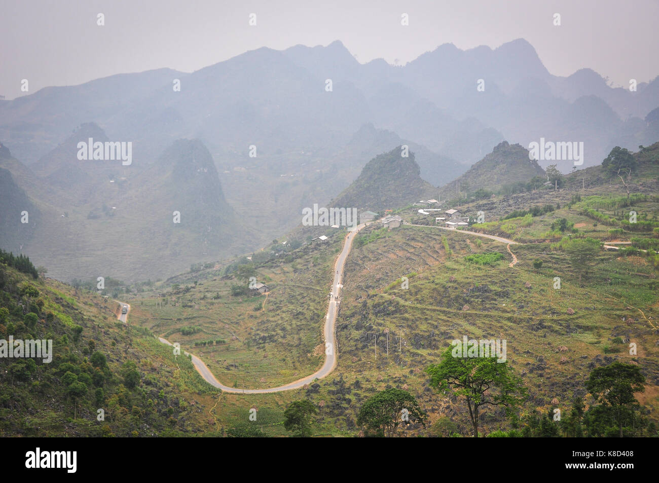 Mountain road in Ha Giang province, Vietnam. Ha Giang has many cultural festivals due to the presence of more than 20 ethnic minority groups. Stock Photo