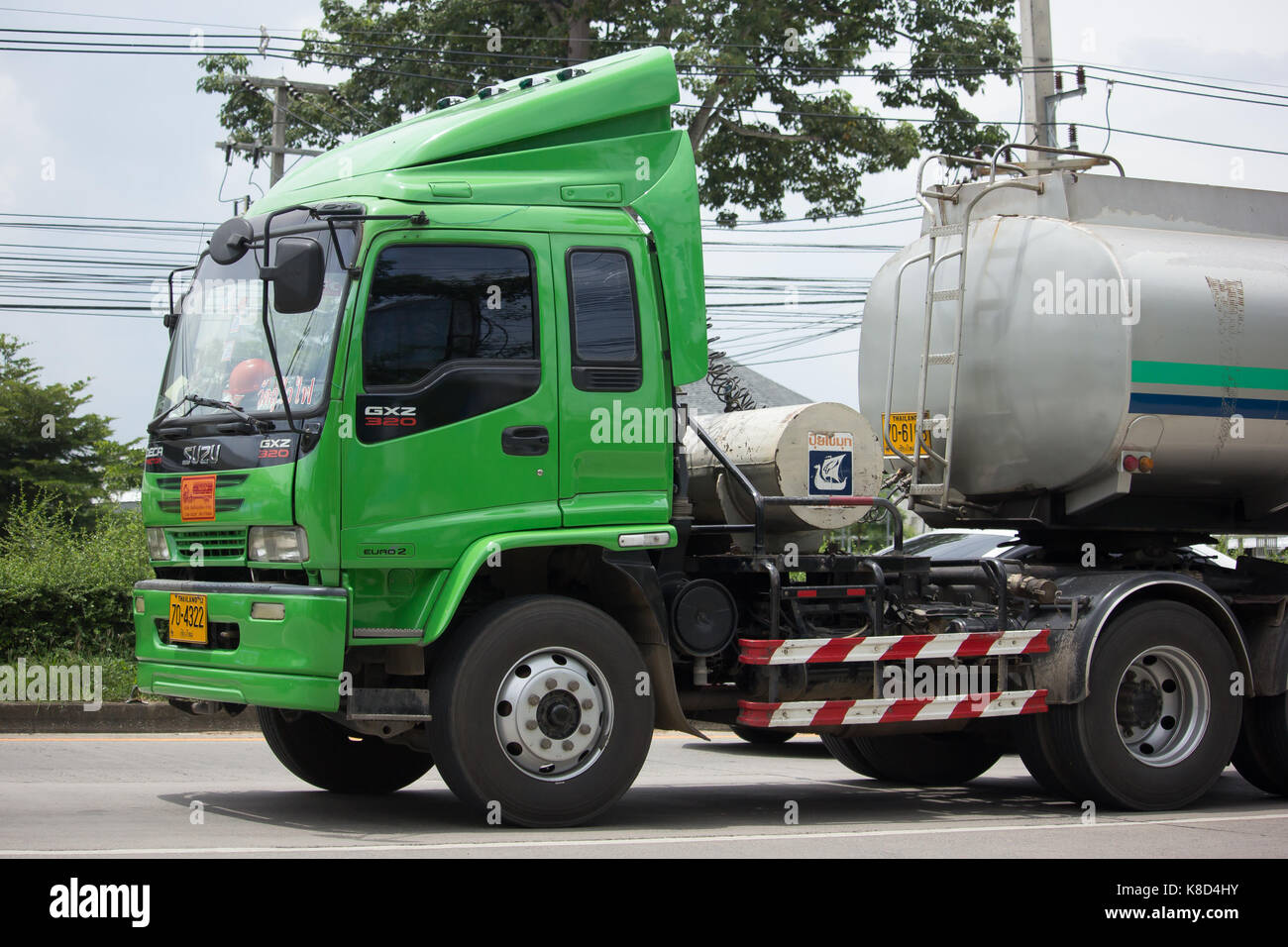 CHIANG MAI, THAILAND - AUGUST 29  2017: Isuzu Trailer Truck and Palm Oil Tank Truck of Suksamran Transport. Photo at road no 121 about 8 km from downt Stock Photo