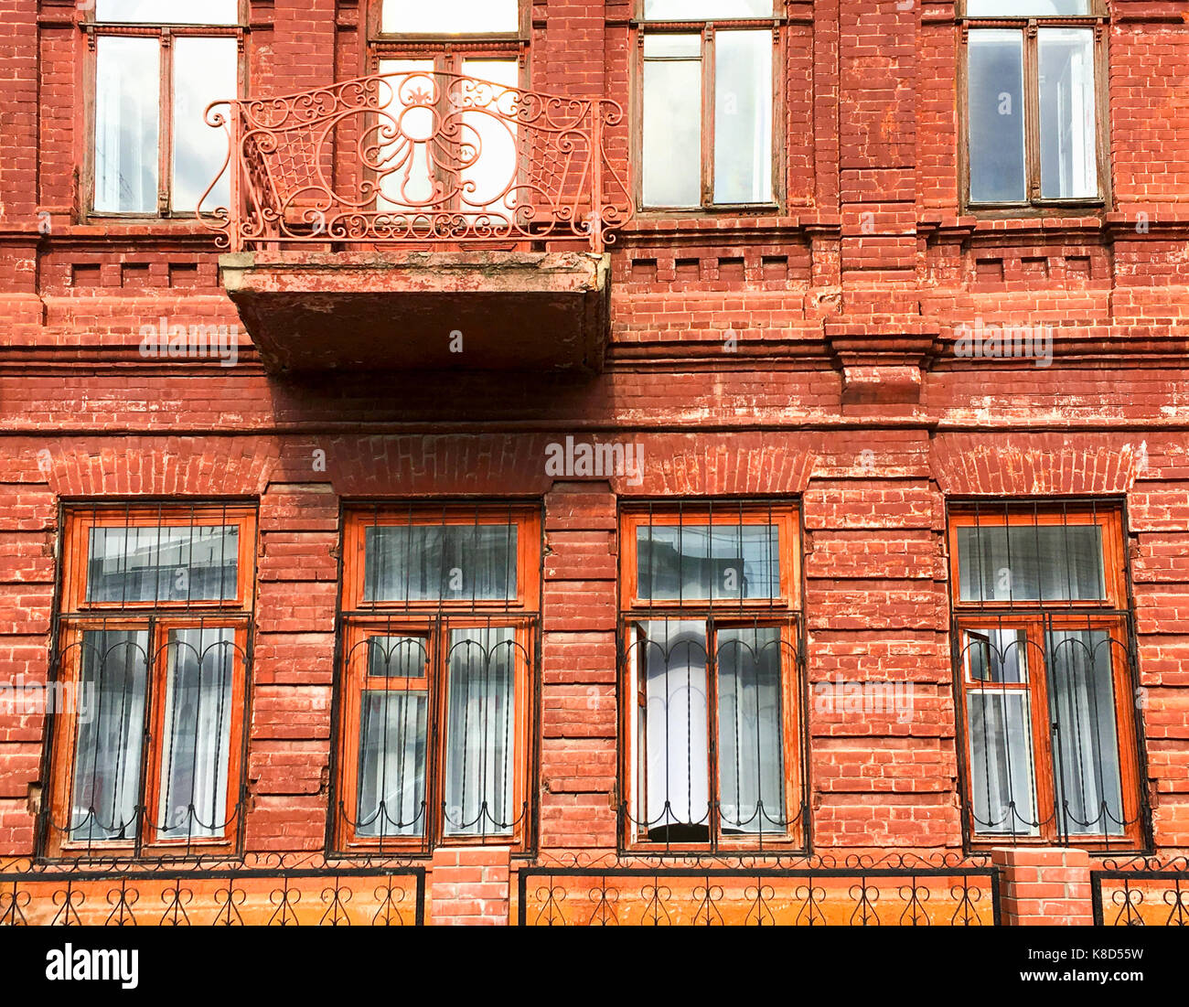 Brick building industrial facade with multiple windows. Industrial background. Stock Photo