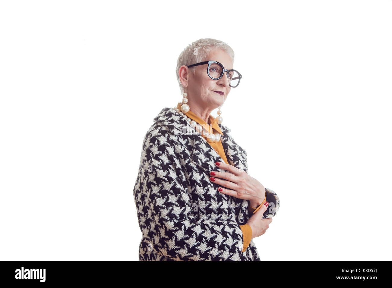 Stylish and elegant old woman in glasses isoladed on white. Stock Photo
