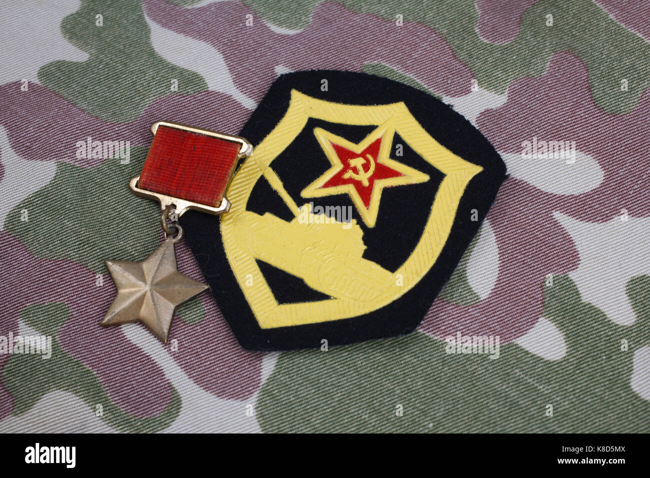 The Gold Star medal is a special insignia that identifies recipients of the title 'Hero' in the Soviet Union on Soviet and Tank Corps shoulder patch o Stock Photo