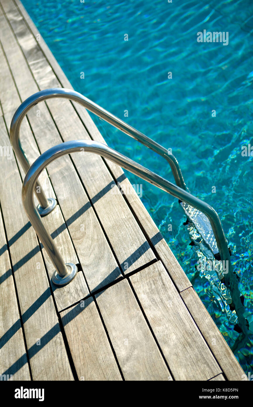 Rustic Pool Ladder Wooden deck and swimming pool ladder in Spring Stock Photo - Alamy