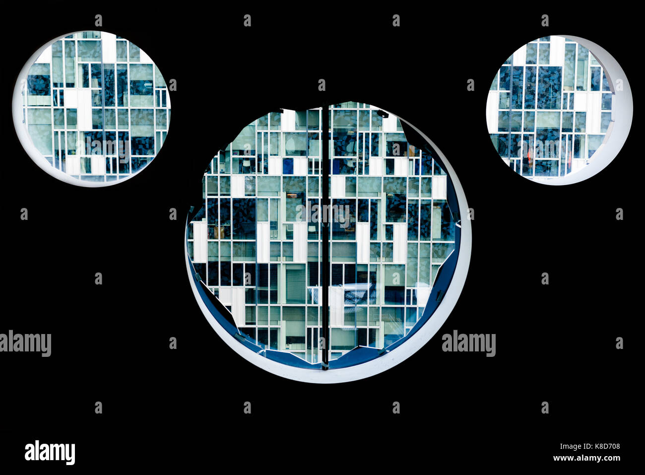 Ravensbourne College round windows showing apartment buildings in Greenwich London Stock Photo