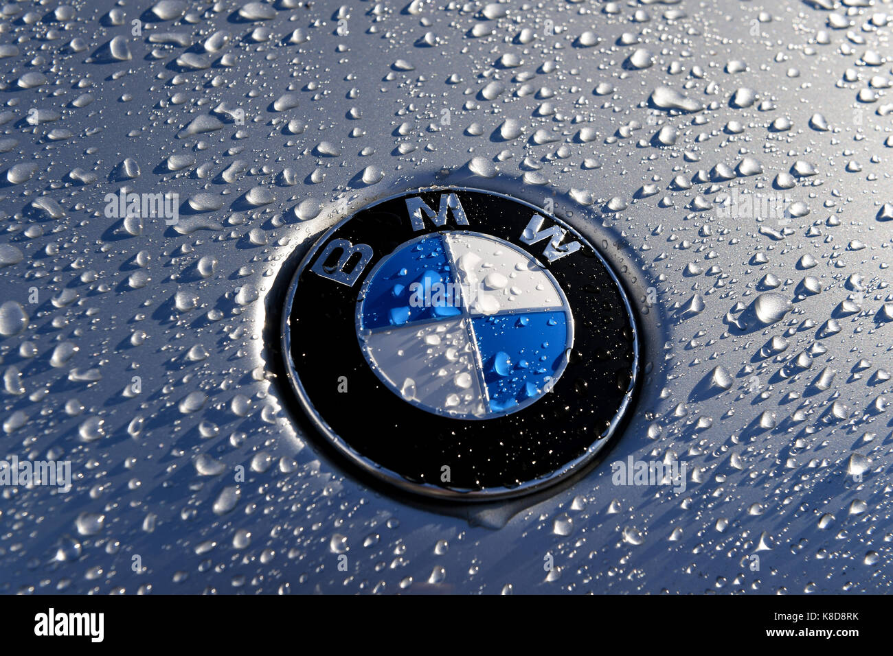 Close up of a BMW badge in wet Stock Photo