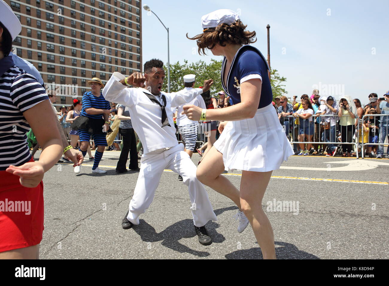 Parade-goers jive at the Mermaid Parade in Coney Island, Brooklyn, New York on June 22, 2013. Stock Photo