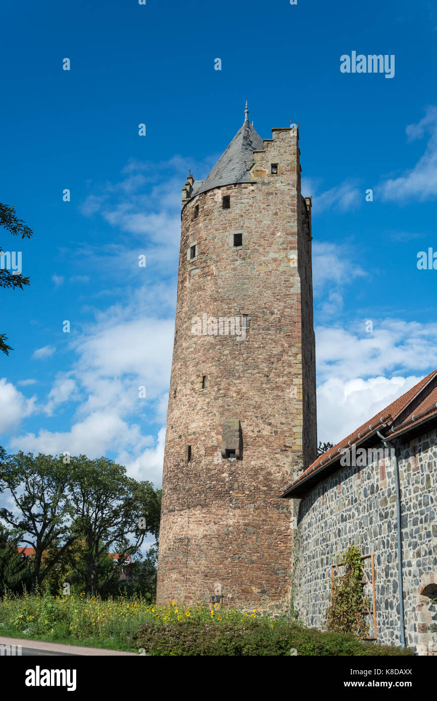 The grey tower as the oldest medieval fortified tower in Germany in the small German town Fritzlar Stock Photo