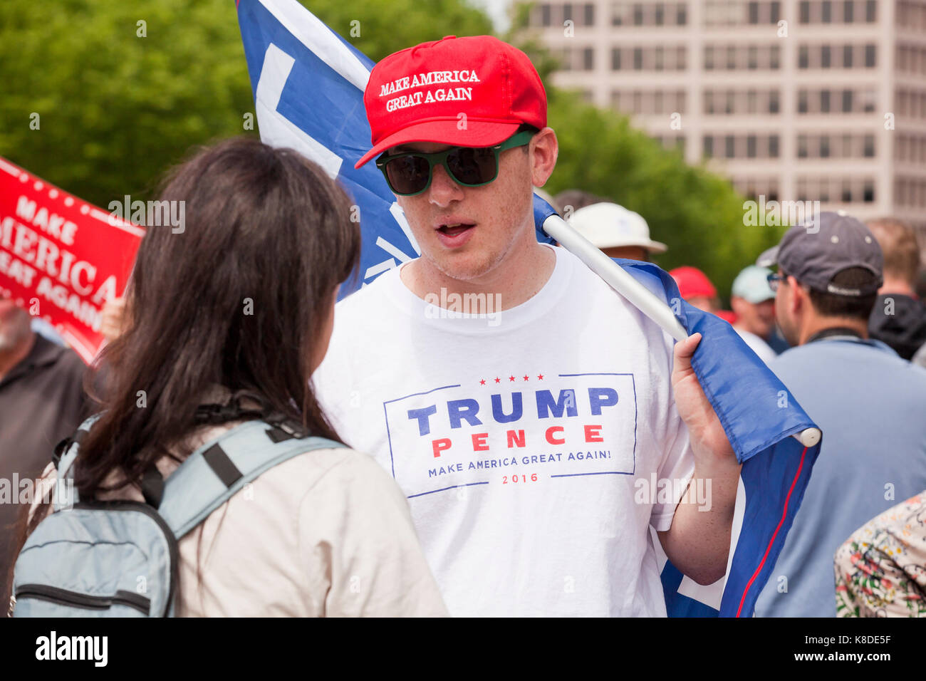 Young Caucasian man wearing Make America Great Again hat at a pro-Trump rally - Washington, DC USA Stock Photo
