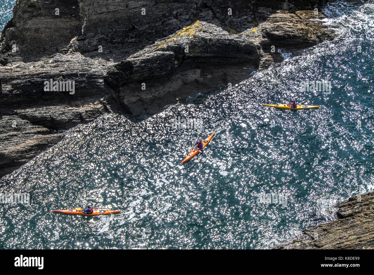 Sea kayakers on Pembrokeshire coast. Stock Photo