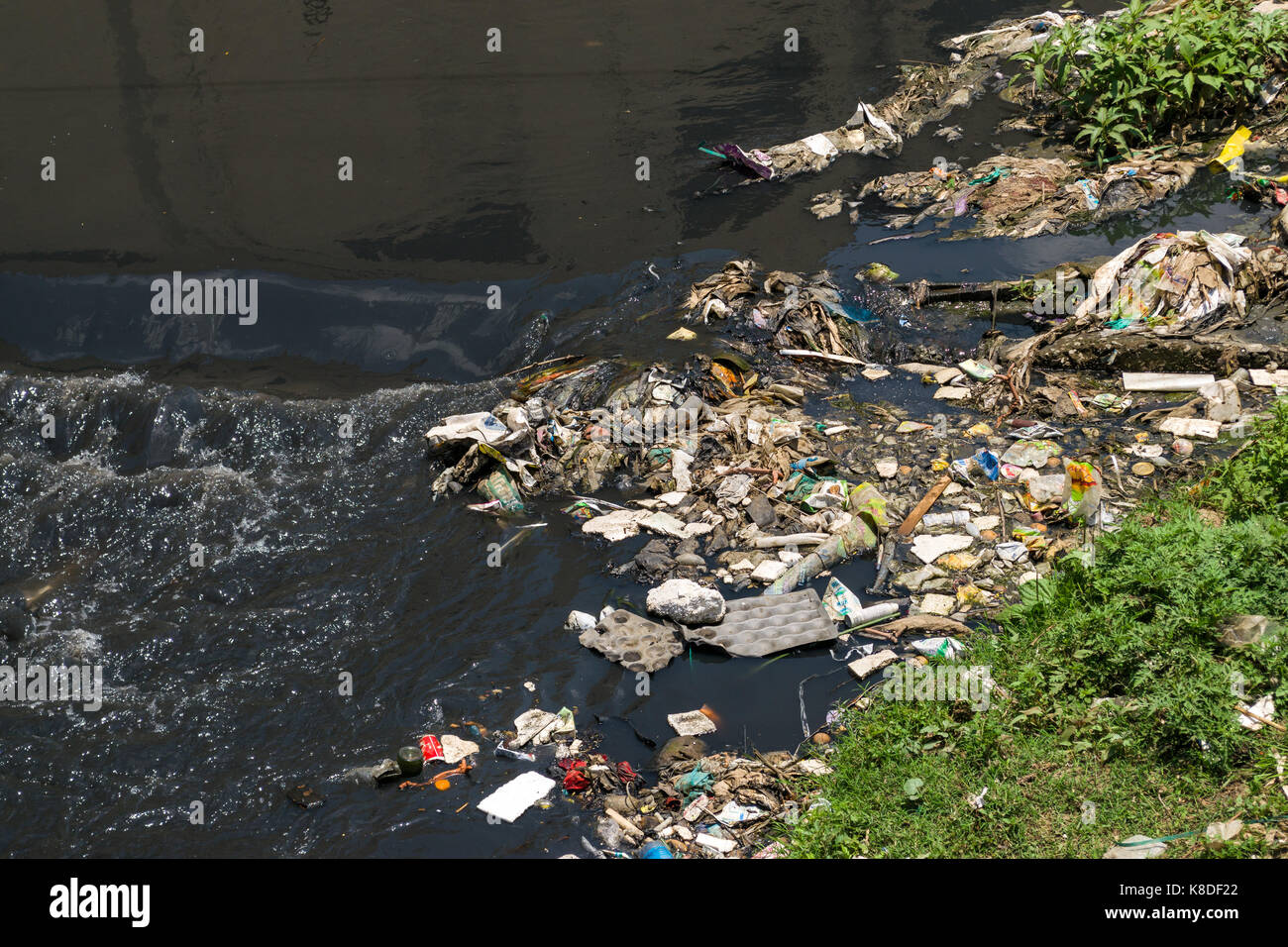 The Ngong river which is polluted with rubbish, plastic waste and garbage, Nairobi, Kenya Stock Photo