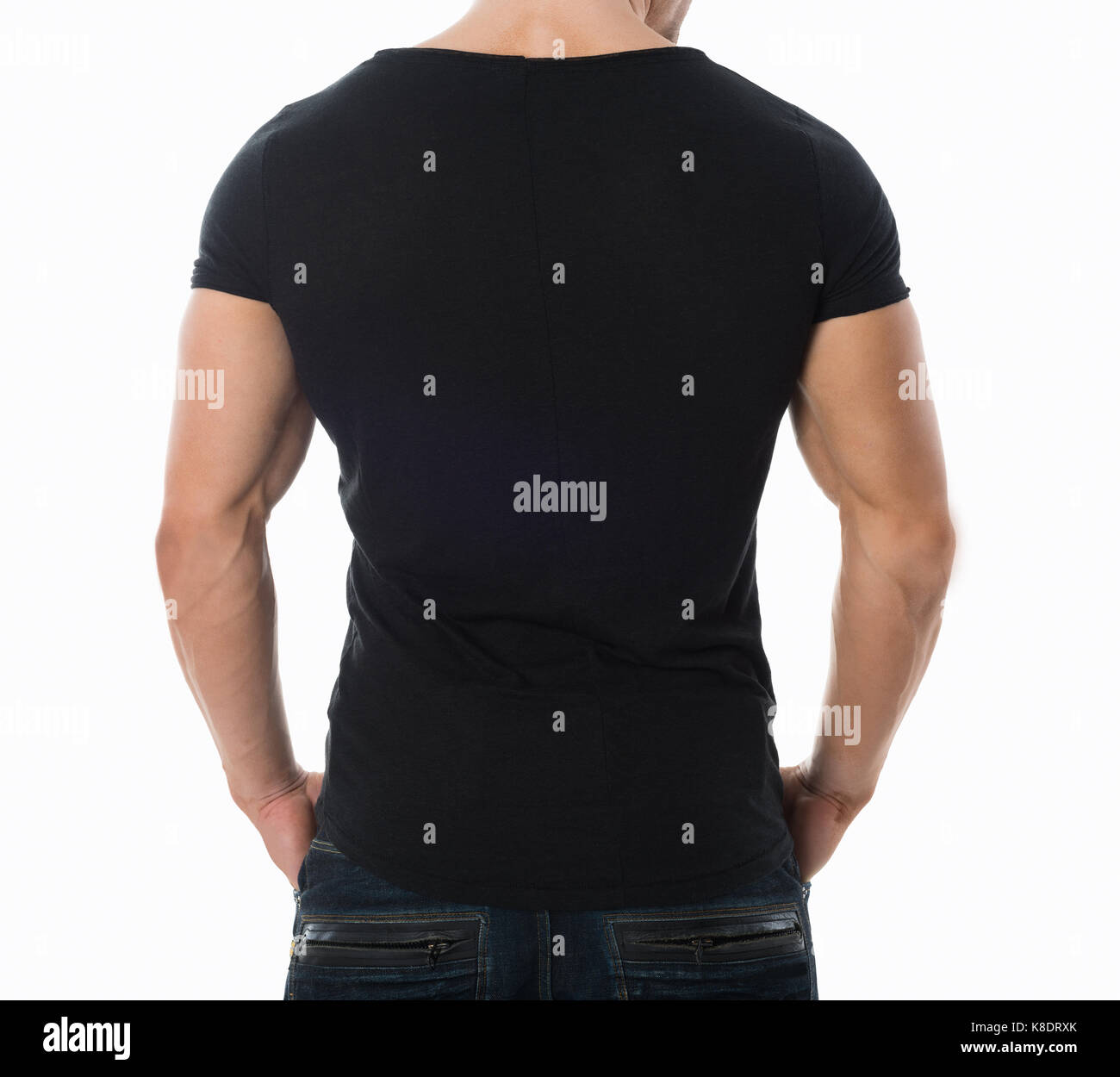 Rear view midsection of man wearing blank black tshirt standing against white background Stock Photo