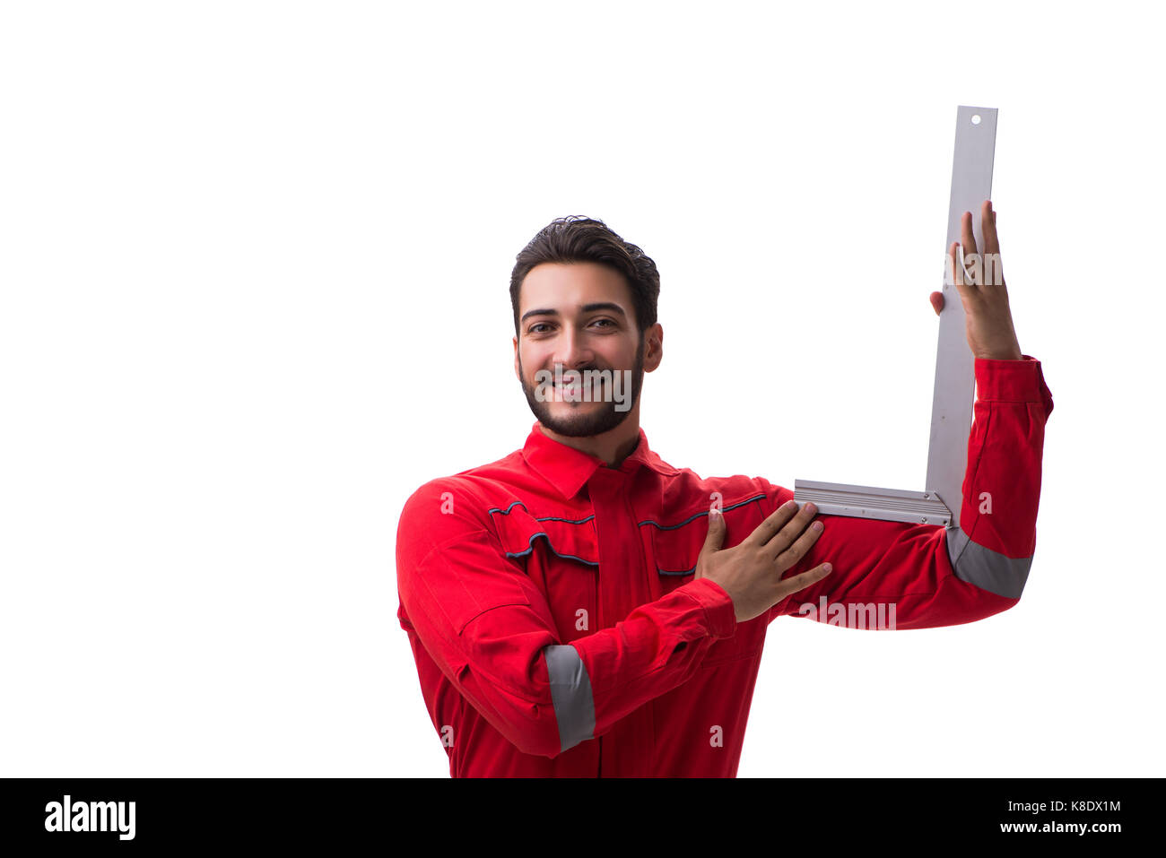 Young repairman with a square ruler isolated on white background Stock ...
