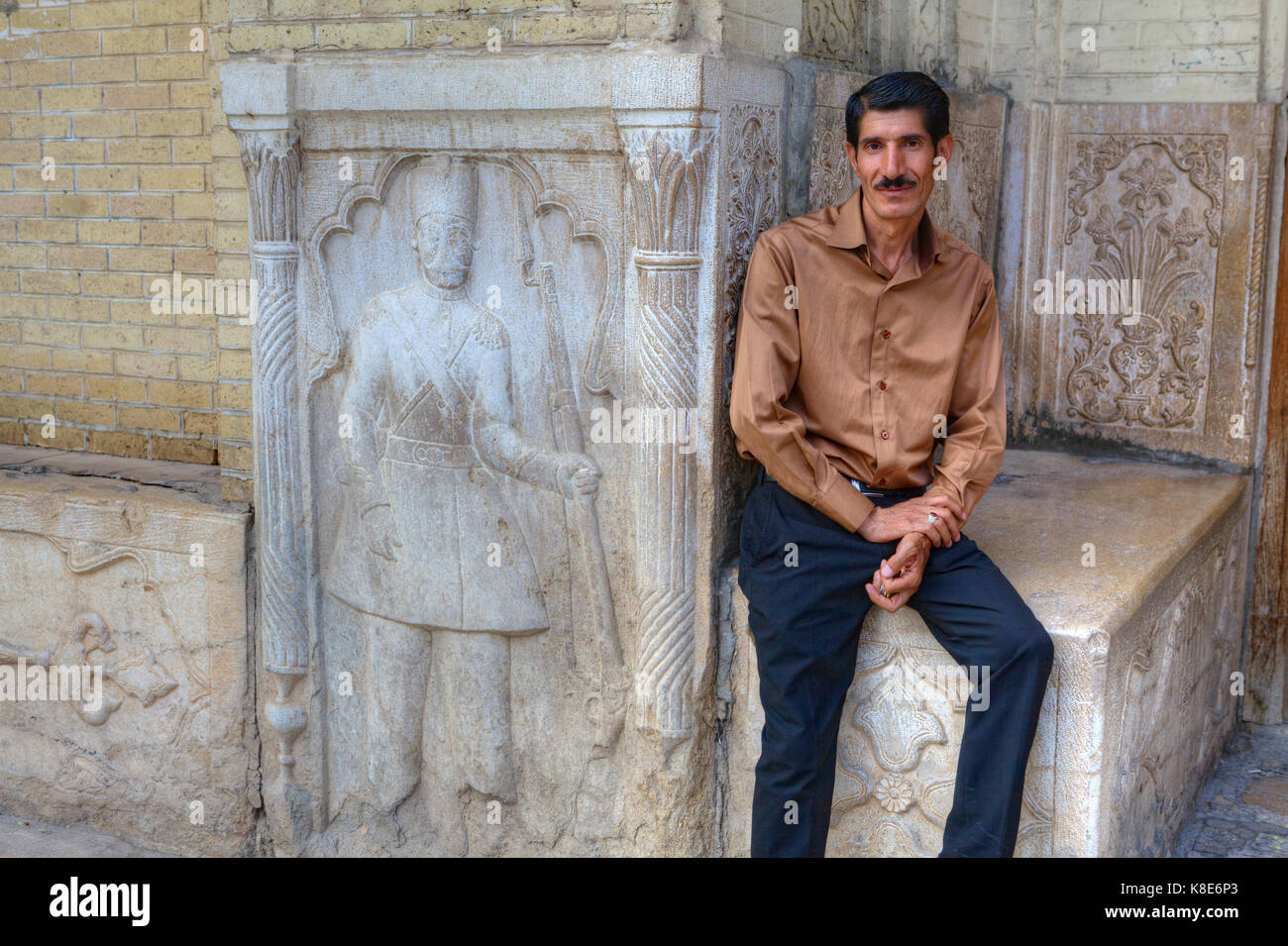 Fars Province, Shiraz, Iran - 18 april, 2017: One mature man is sitting  near the facade bas-relief Stock Photo - Alamy