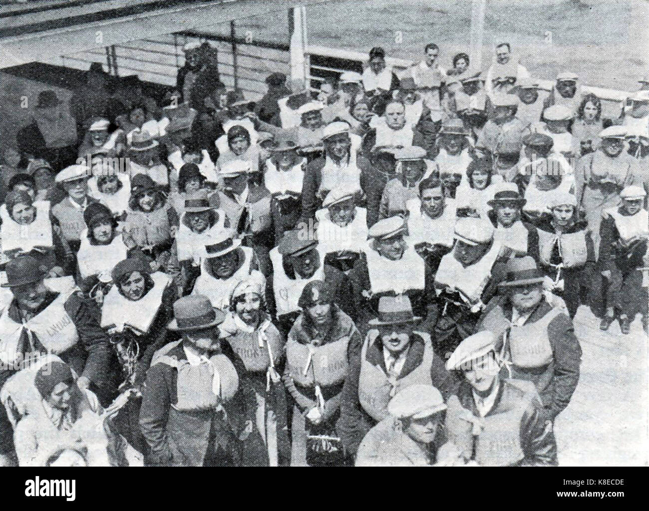 Passenger lifesaving drill on RMS Berengaria -1933.  The Cunard liner Berengaria ( formerly SS Imperator) was the largest passenger ship in the world.-  Between 1934 and 1938 the vessel sailed the Southampton to New York  route via Cherbourg. During the years of US prohibition, Berengaria was used for discounted Prohibition-dodging cruises, which attracted the nickname 'Bargain-area' Stock Photo