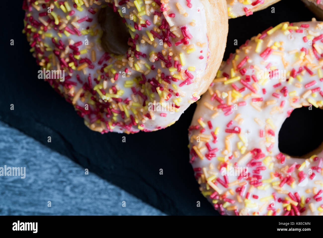 A close up of donuts on a slate. Stock Photo