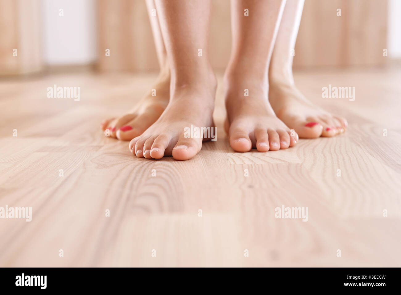 Foot gymnastics.Feet of mother and baby Stock Photo