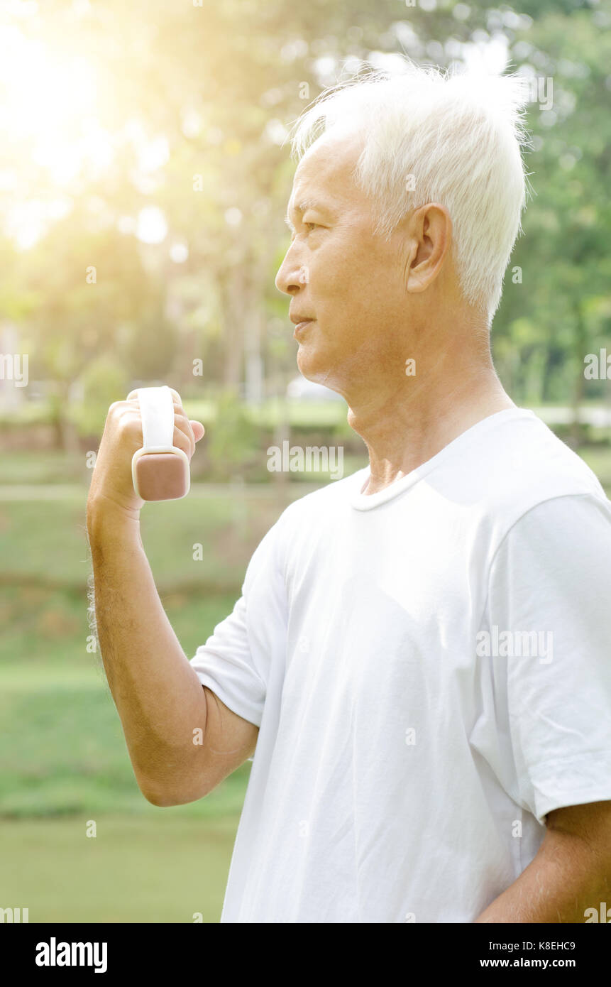 Portrait Of Active Healthy White Hair Asian Old Man Workout At