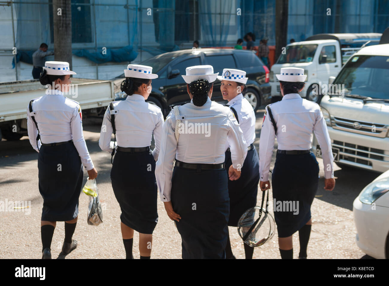 27.01.2017, Yangon, Yangon Region, Republic of the Union of Myanmar, Asia - A group of female traffic police officers walks along the side of a road. Stock Photo