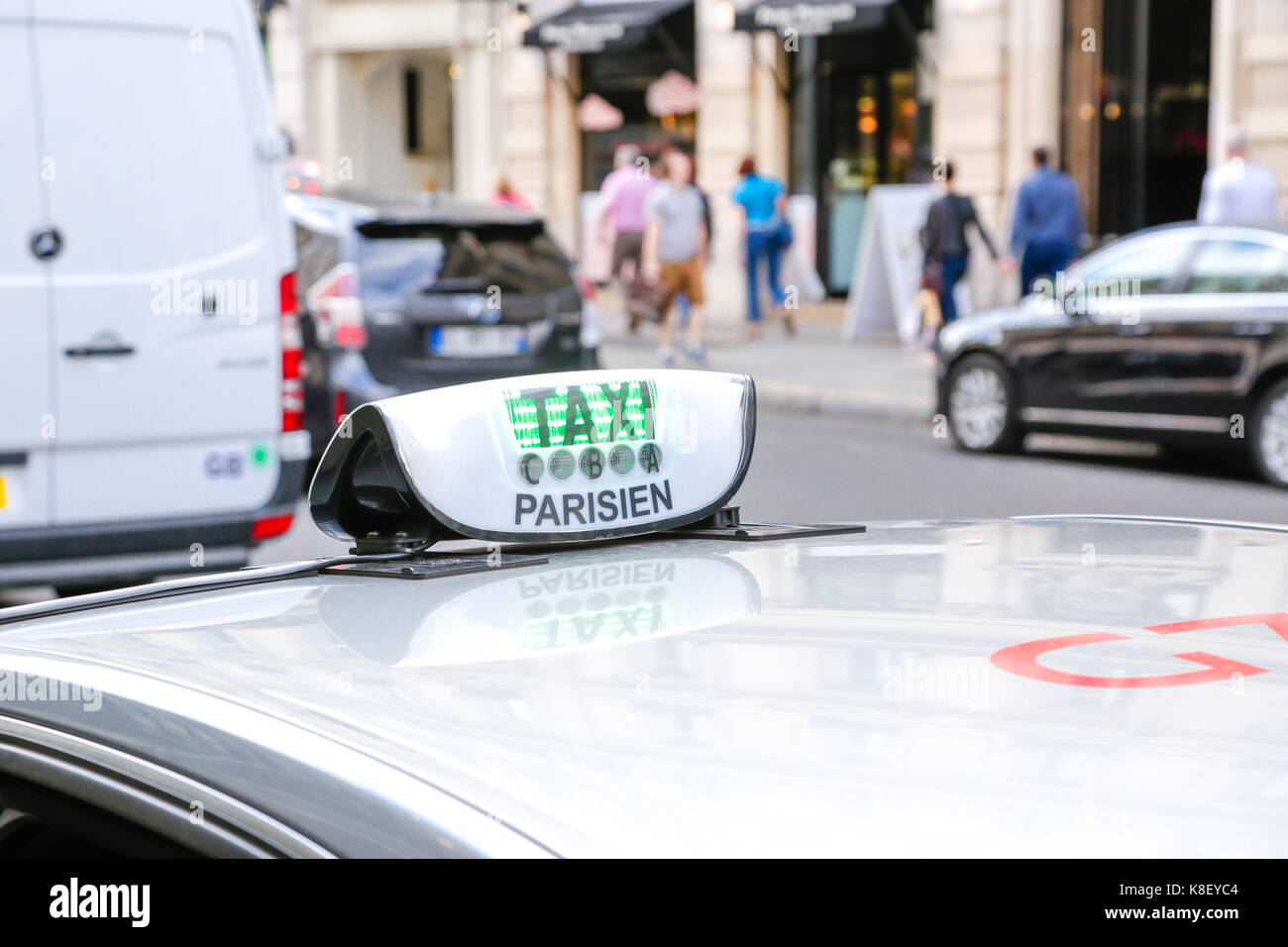 Paris, France: parisian taxi logo in the central district of Paris Stock  Photo - Alamy