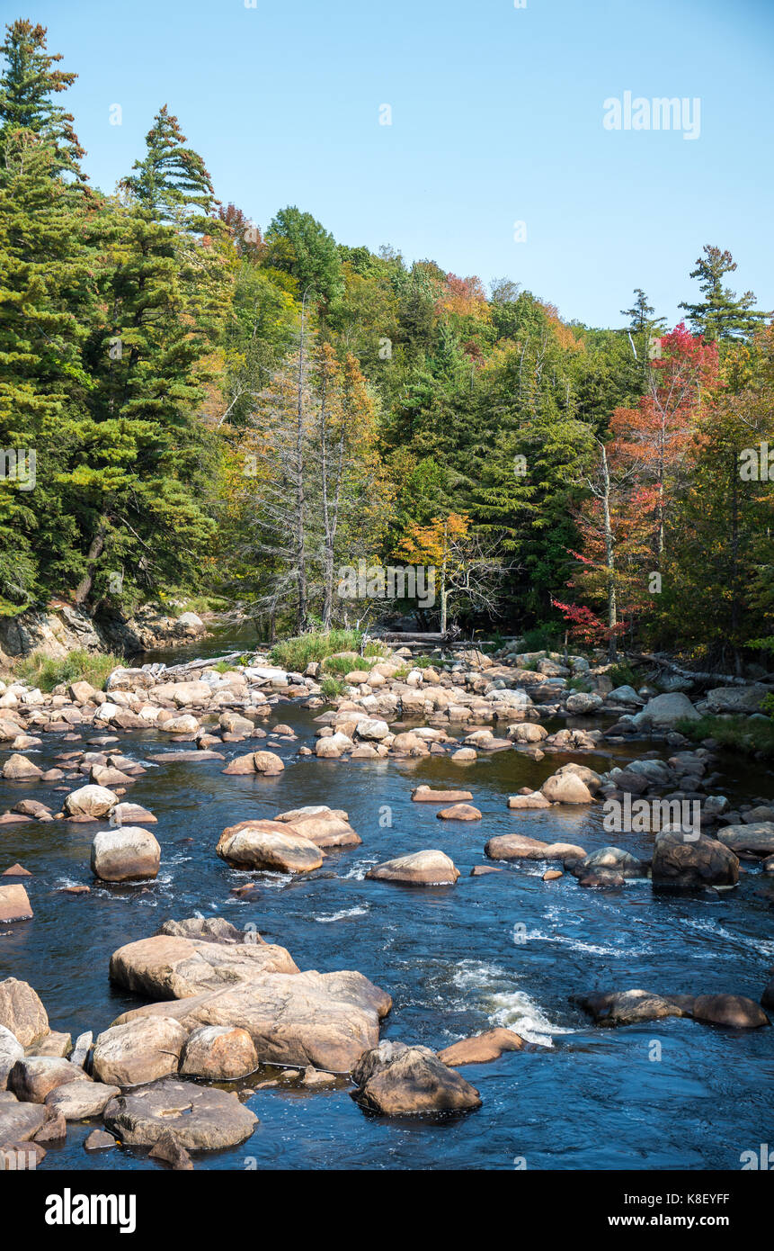 Rocky river in early fall Stock Photo - Alamy