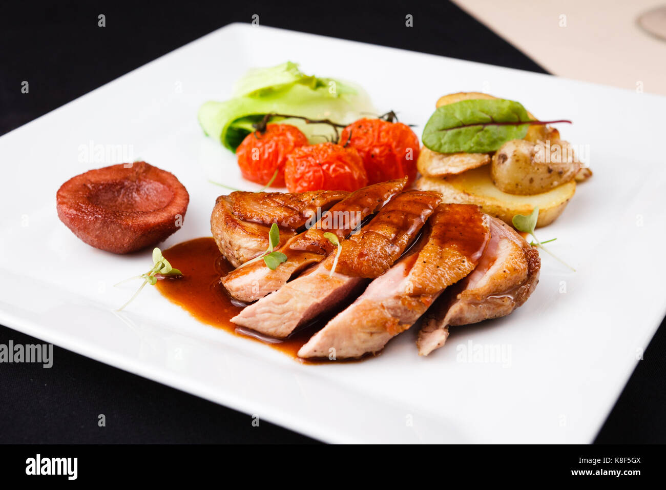 Roasted duck with pear Stock Photo