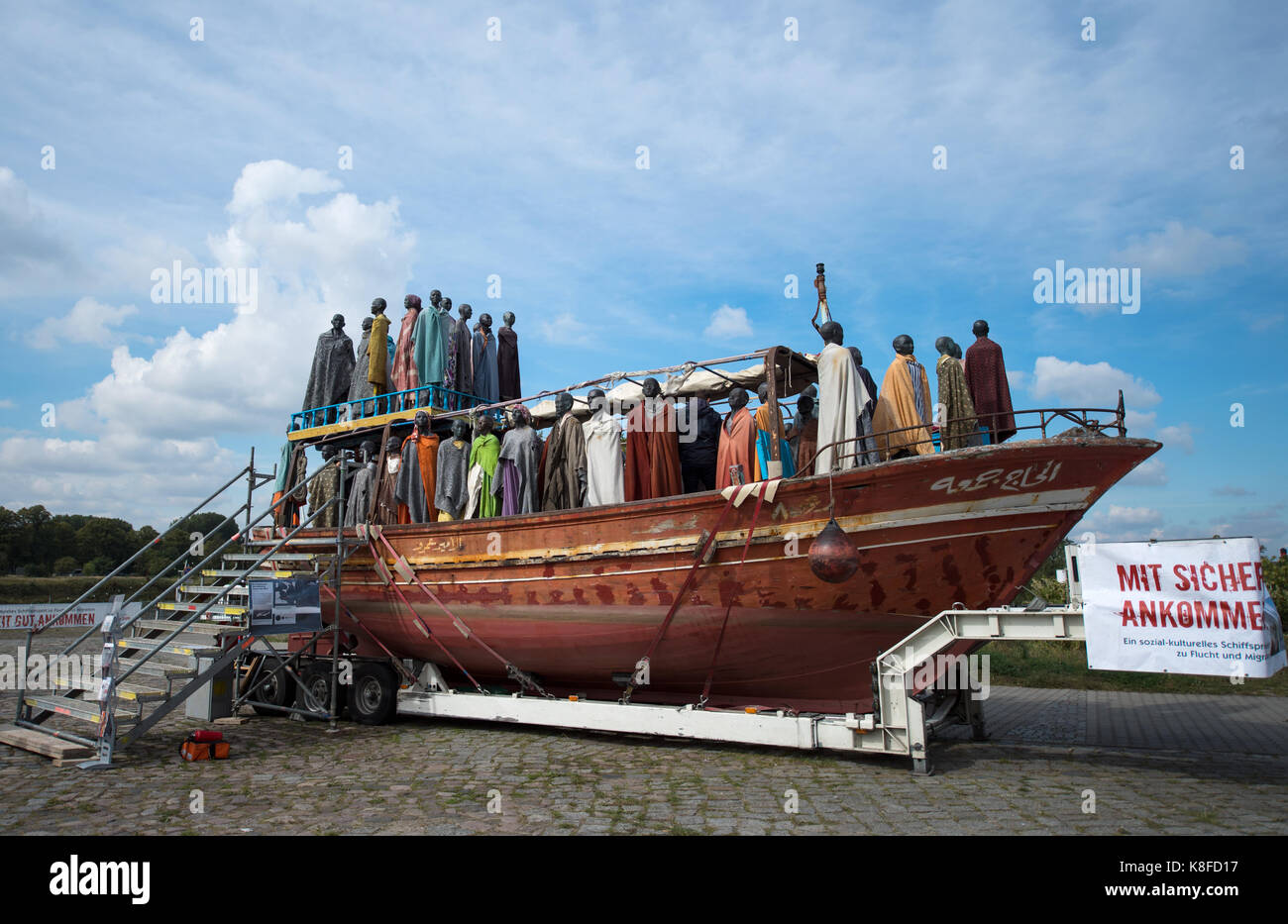 Dresden, Germany. 19th Sep, 2017. Copper figures of the Danish artist Jens Galschiøt can be seen for the project 'Mit Sicherheit gut ankommen' (lit. 'To arrive with security') on board of the former refugee boat 'Al-hadj Djumaa' at the river Elbe in Dresden, Germany, 19 September 2017. The 80 figures are supposed to represent refugees. Credit: Monika Skolimowska/dpa-Zentralbild/dpa/Alamy Live News Stock Photo
