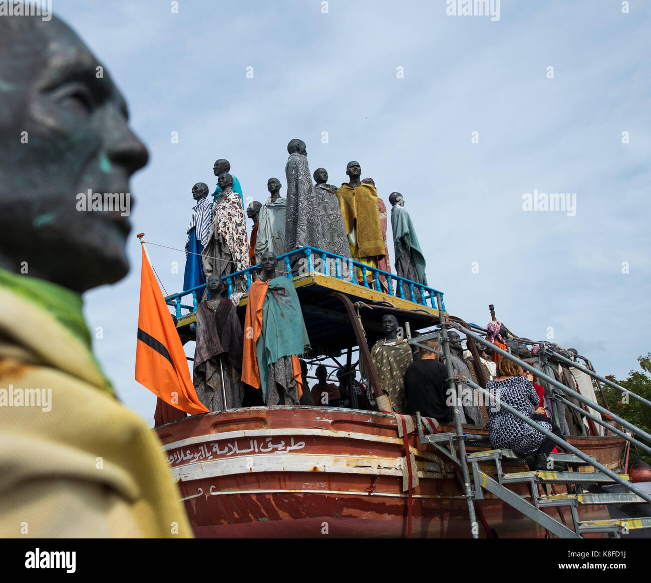 Dresden, Germany. 19th Sep, 2017. Copper figures of the Danish artist Jens Galschiøt can be seen for the project 'Mit Sicherheit gut ankommen' (lit. 'To arrive with security') on board of the former refugee boat 'Al-hadj Djumaa' at the river Elbe in Dresden, Germany, 19 September 2017. The 80 figures are supposed to represent refugees. Credit: Monika Skolimowska/dpa-Zentralbild/dpa/Alamy Live News Stock Photo