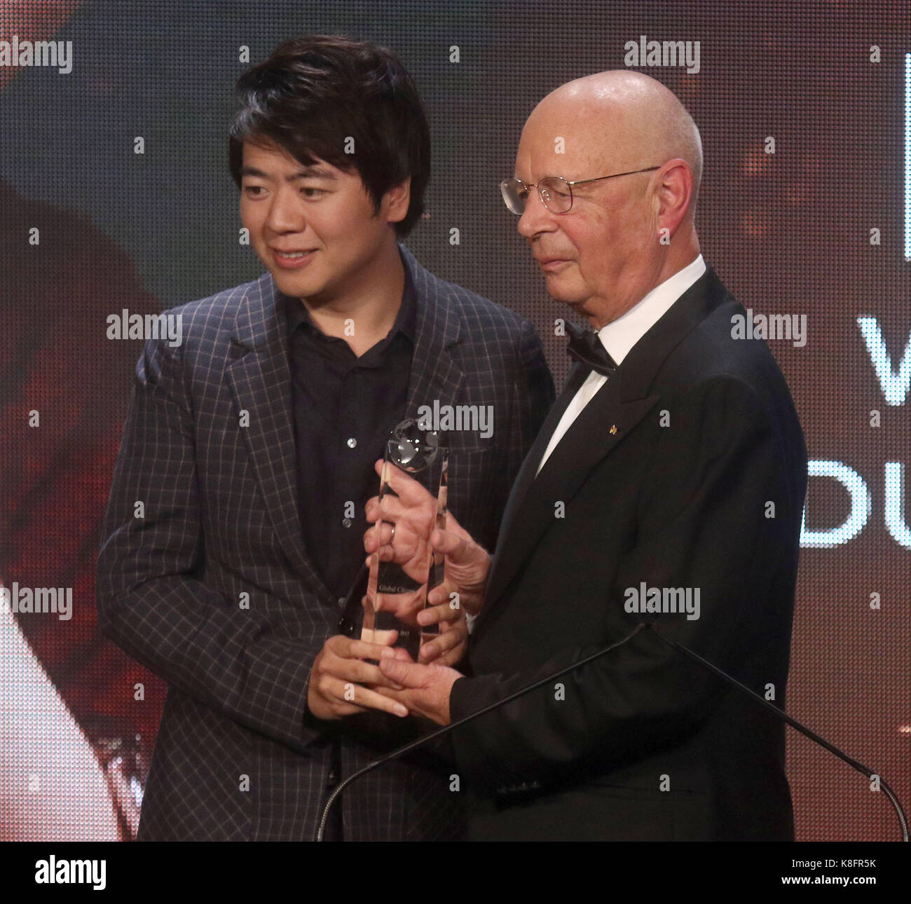 New York, New York, USA. 19th Sep, 2017. Founder and Executive Chairman of the World Economic Forum, presenter KLAUS SCHWAB and award recipient Chinese pianist LANG LANG attend the Atlantic Council 2017 Global Citizen Awards held at the Intrepid Sea, Air, & Space Museum. Credit: Nancy Kaszerman/ZUMA Wire/Alamy Live News Stock Photo