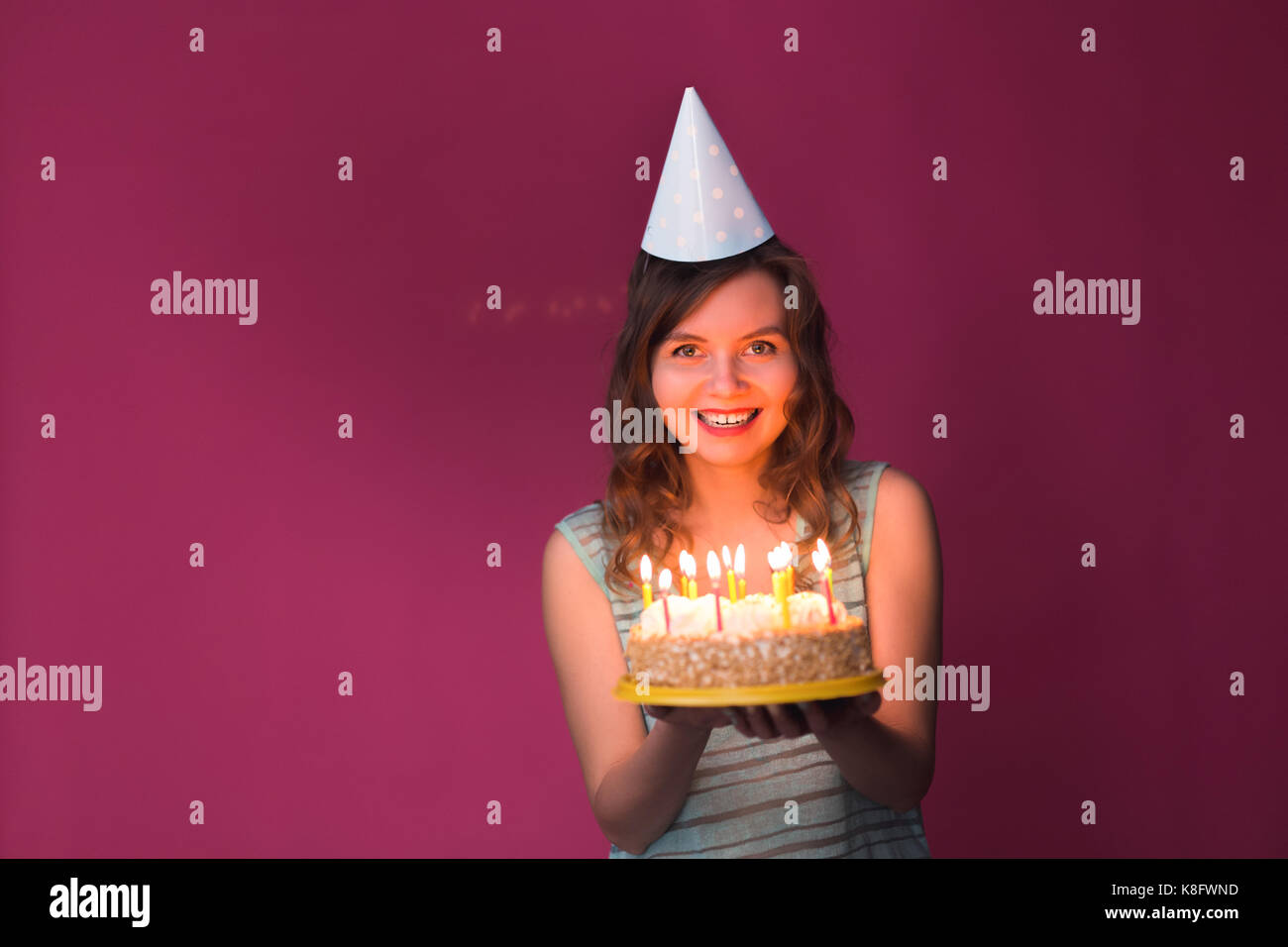 Portrait of pretty girl holding birthday cake Stock Photo Alamy