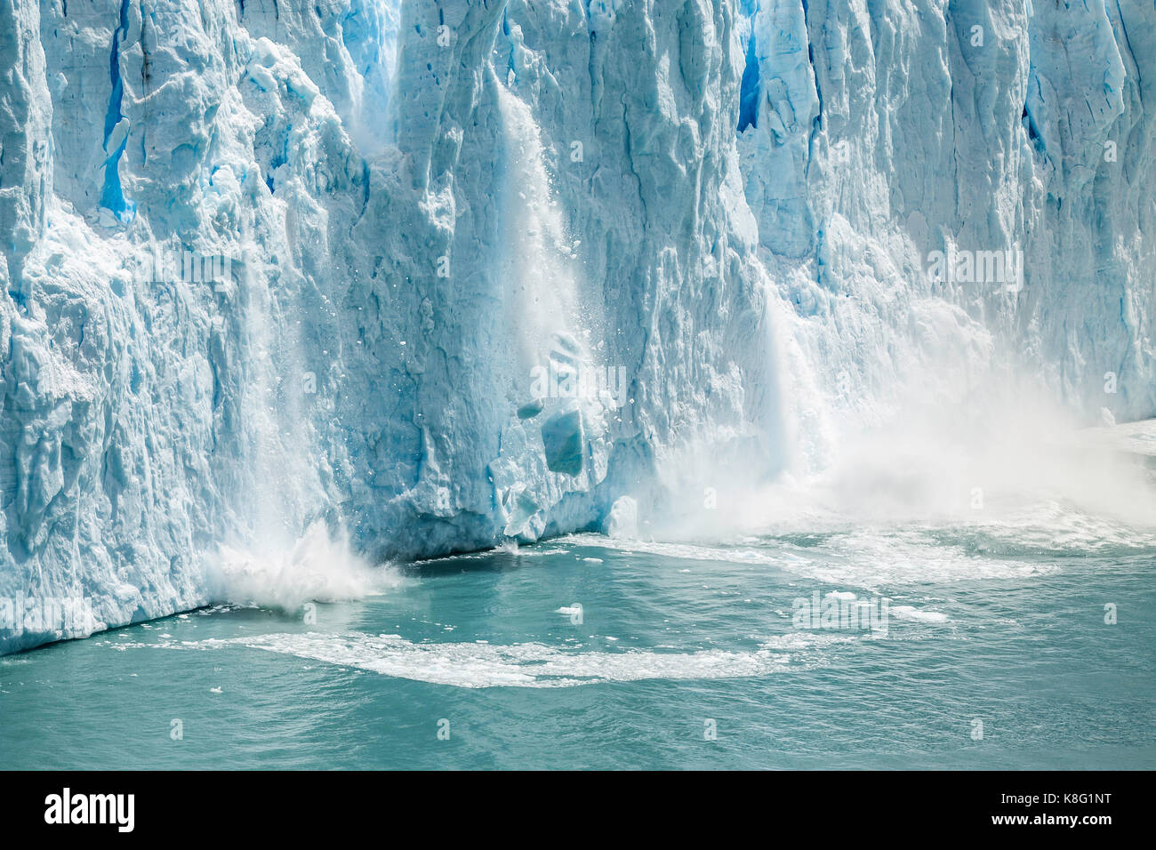 Ice from Perito Moreno Glacier falling into Lake Argentino, Los Glaciares National Park, Patagonia, Chile Stock Photo