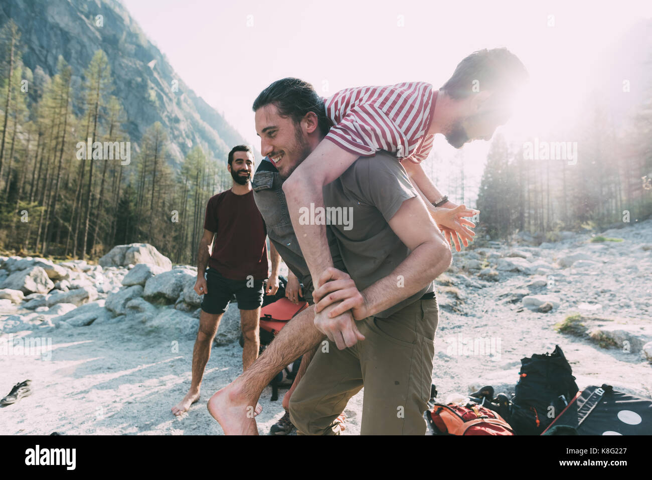 Man carrying woman over shoulder hires stock photography and images