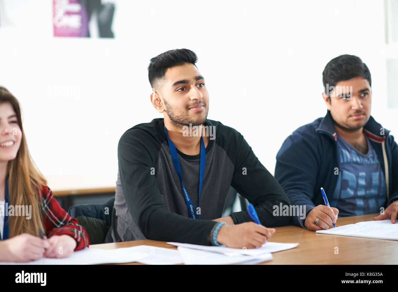 Students studying in classroom Stock Photo