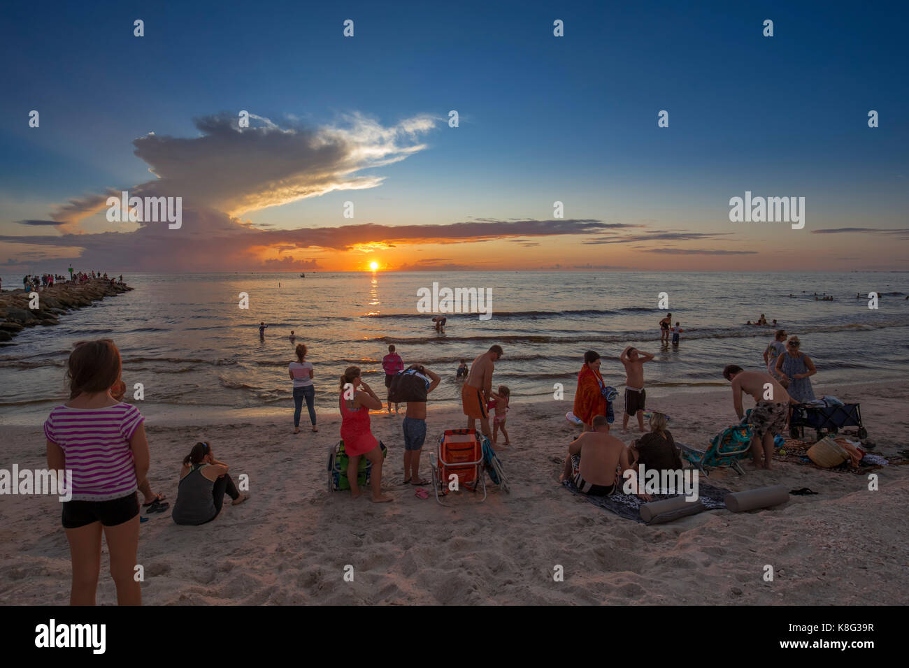People watching sunset at North Jetty over the Gulf of Mexico in Nokomis Florida Stock Photo