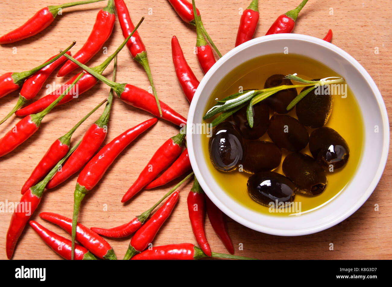 black olives and chili peppers Stock Photo Alamy