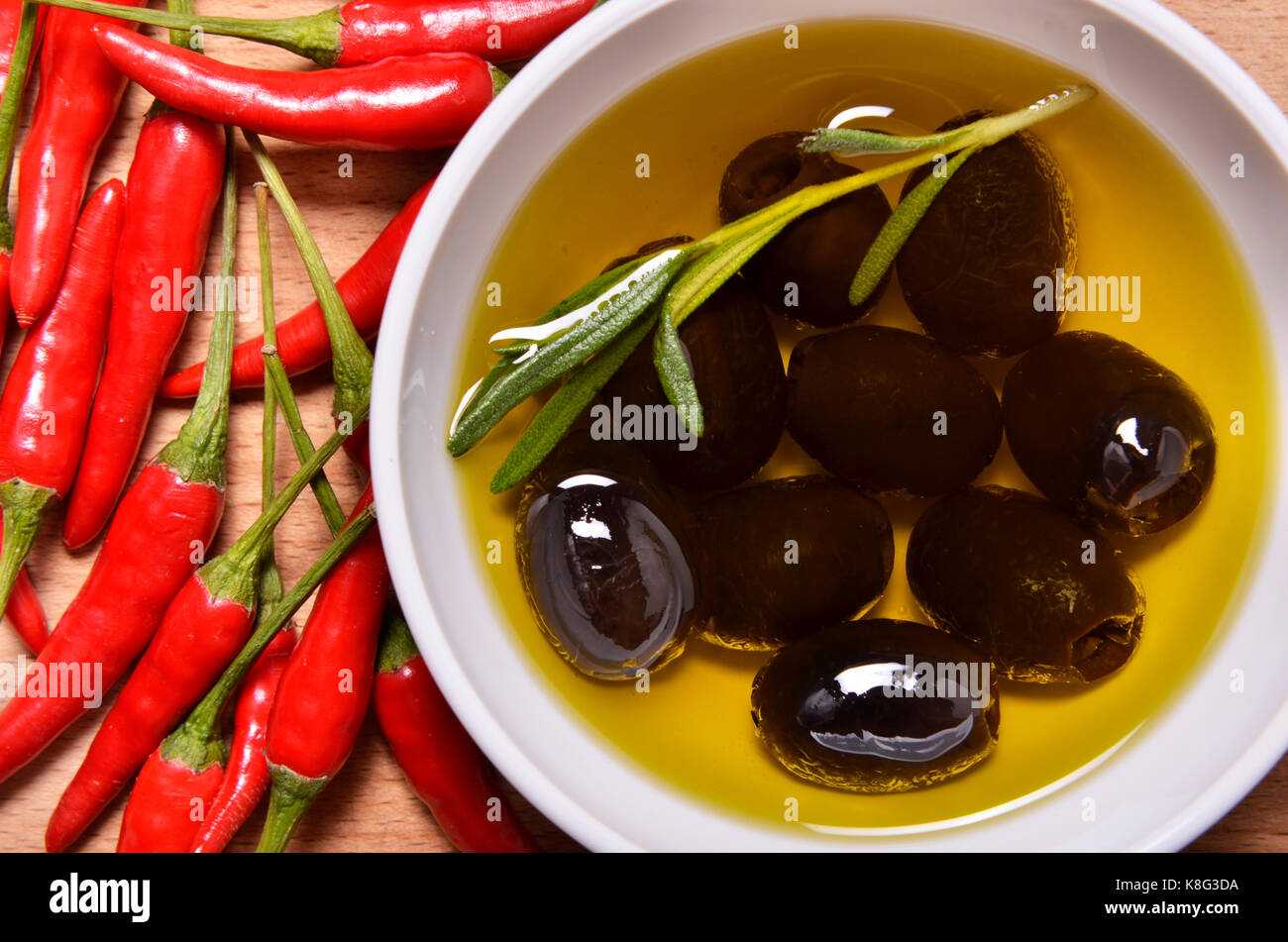 black olives and chili peppers Stock Photo Alamy